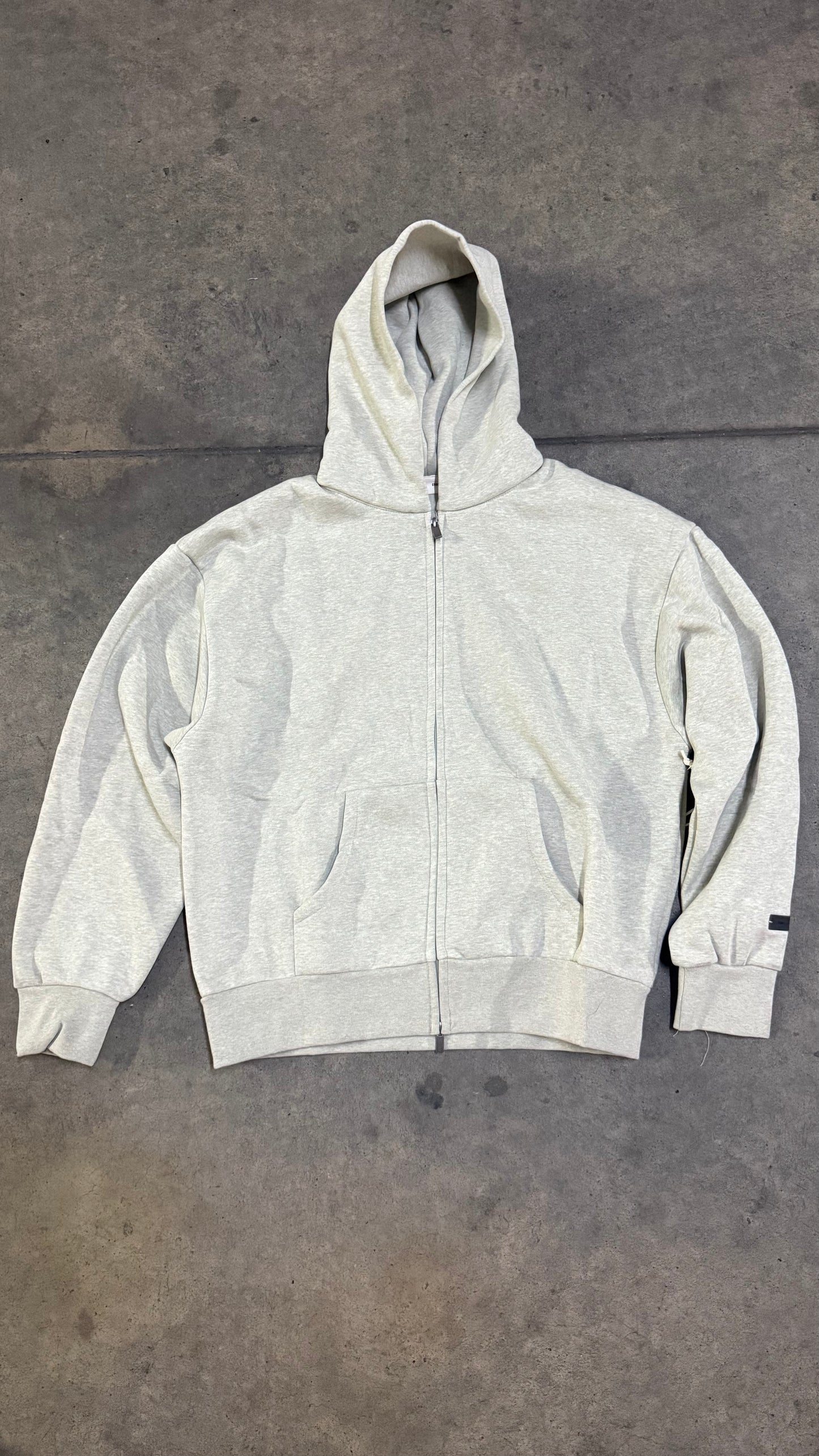 HOODIE ESSENTIALS GRIS CLARO ZÍPER